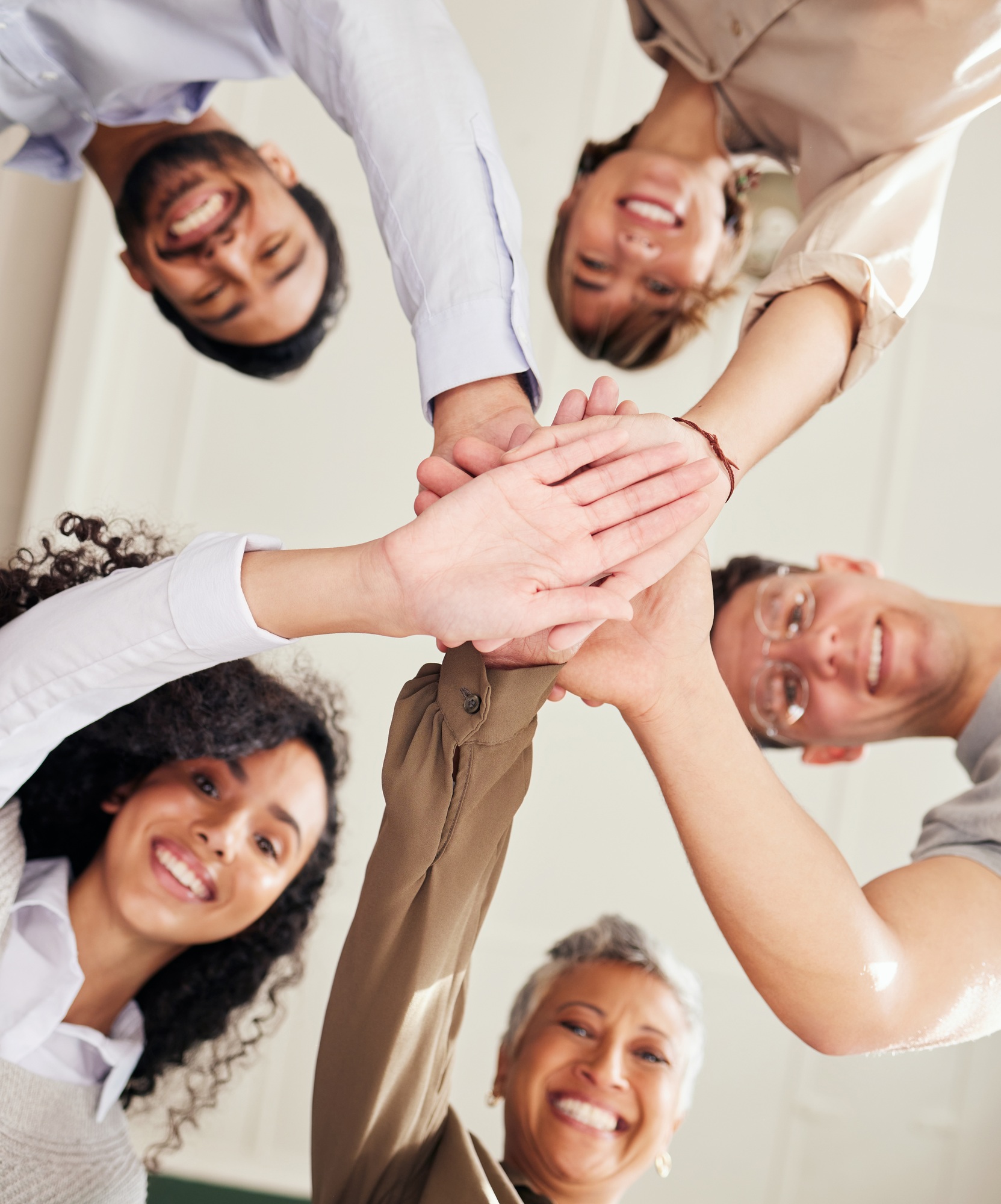 Inicio 2 Teamwork, people portrait and hands stacked in support, collaboration or team building mission from